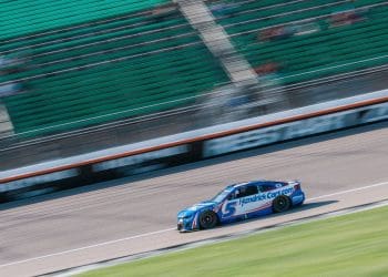Intense Showdown: Kyle Larson Outpaces Chris Buescher for Thrilling Kansas Pole Victory