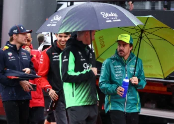 Max Verstappen’s Epic Battle: McLaren, Ferrari Threaten Victory at Rain-Drenched Silverstone