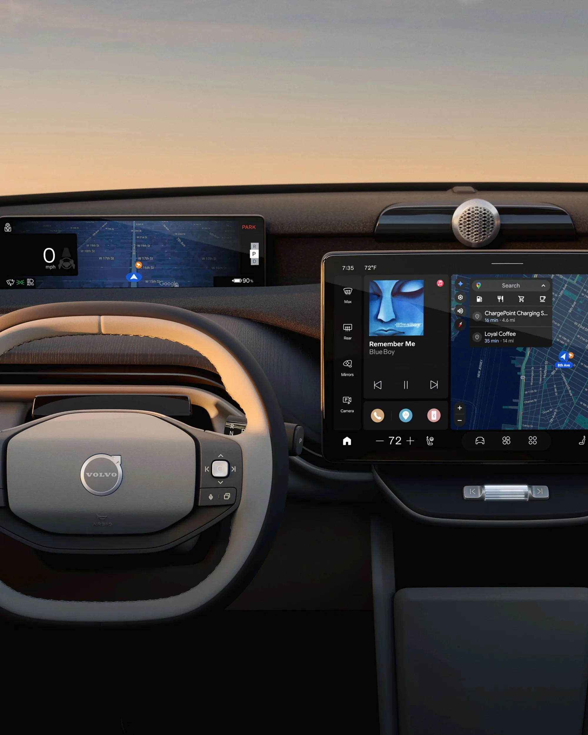The dashboard of the Volvo EX60 showing the steering wheel, driver display and center display.