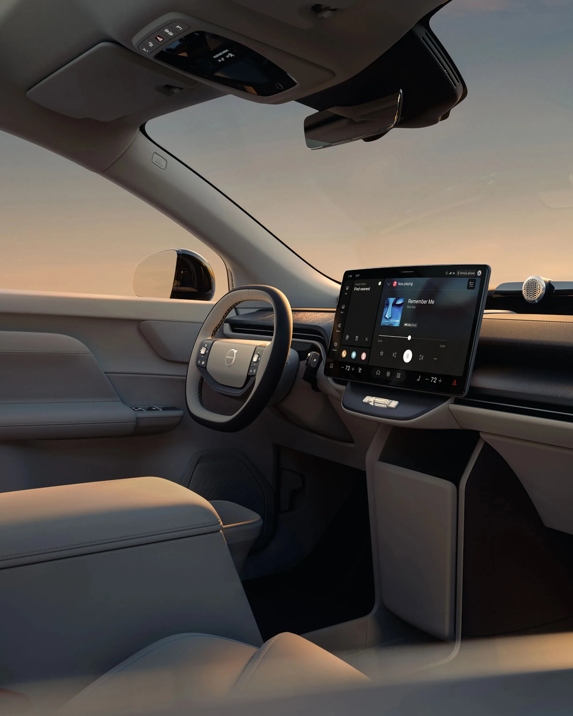 The interior of the Volvo EX60 showing the steering wheel, center display and front seats.