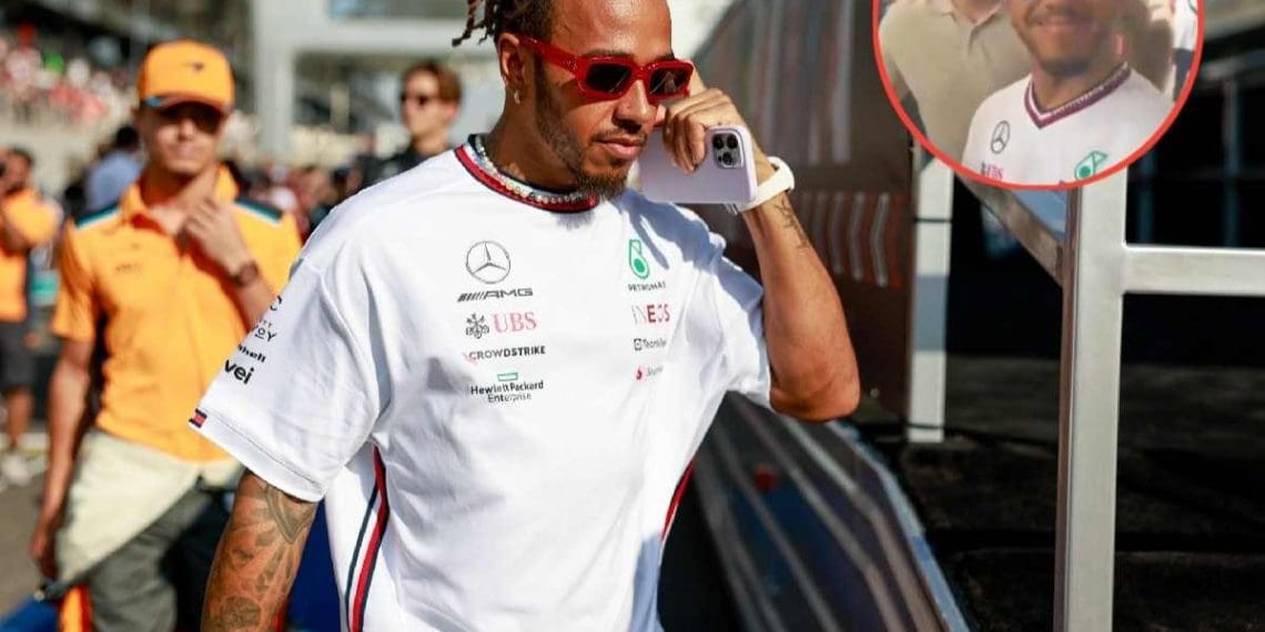 Fãs explodem de alegria ao ver Lewis Hamilton assinar um boné da Ferrari com um sorriso travesso.